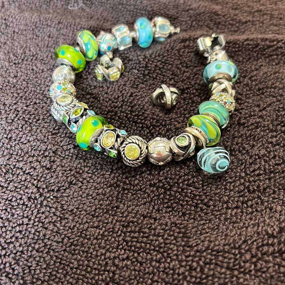 Pandora bracelet with two extra beads.